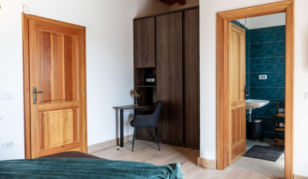 Luxurious, spacious bedroom with king-size bed and en-suite bathroom with walk-in shower