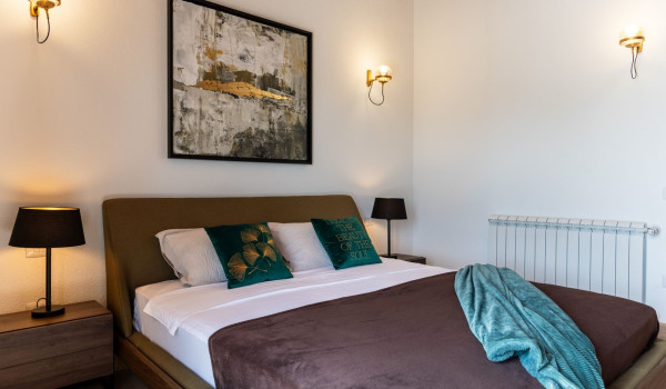 Luxurious, spacious bedroom with king-size bed and en-suite bathroom with walk-in shower