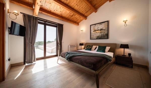 Luxurious, spacious bedroom with king-size bed and en-suite bathroom with walk-in shower