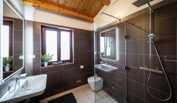 Luxurious, spacious bedroom with king-size bed and en-suite bathroom with walk-in shower