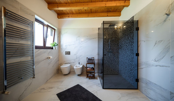 Luxurious, spacious bedroom with king-size bed and en-suite bathroom with walk-in shower