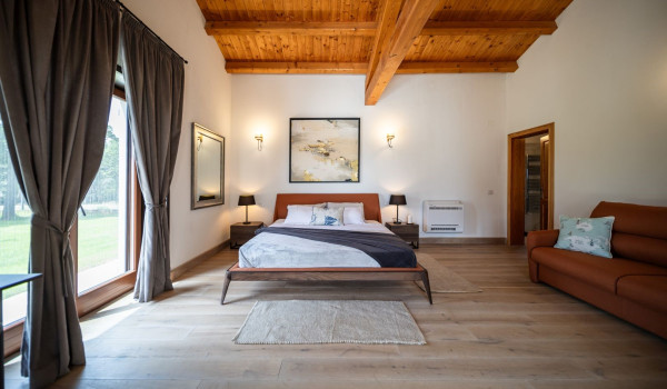 Luxurious, spacious bedroom with king-size bed and en-suite bathroom with walk-in shower