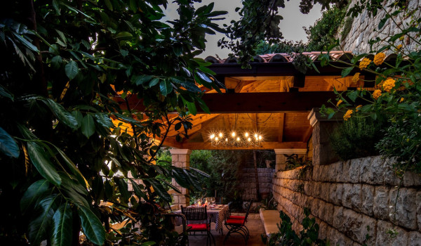 Outside dining table on the terrace of the luxury vacation villa Dubrovnik Palace with concierge service