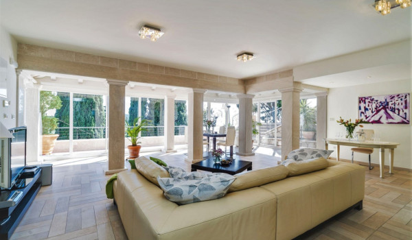 Living room with large comfortable sofa and working space  in a Dubrovnik luxury villa for family vacation by the sea