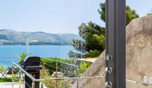Outdoor shower in the yard of the Croatian luxury villa for rent and vacation L'Amour