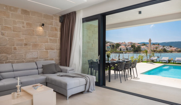 A view of the dining area in the courtyard of this Croatian luxury villa for rent and vacation