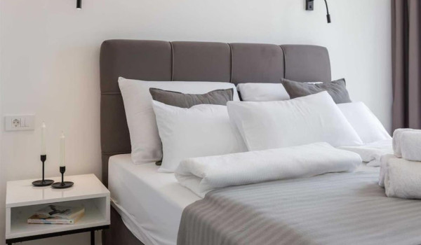 Modern double bedroom with sea view and en-suite bathroom