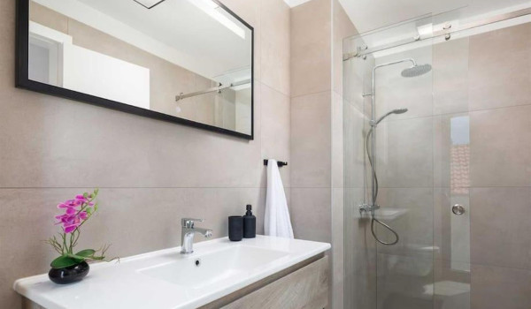 Modern double bedroom with sea view and en-suite bathroom