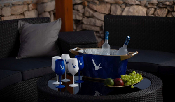 Outdoor furniture with served drinks in luxury private villa Lighthouse on Vis with jacuzzi by the sea with complete privacy