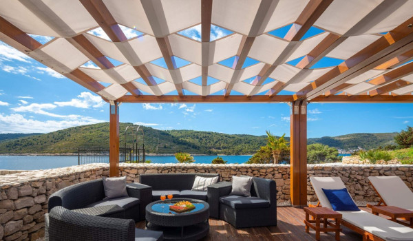 Lounge zone under eaves in luxury holiday private villa Lighthouse Ligero on Vis for total privacy by the sea.