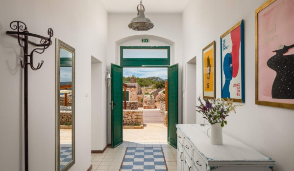 Playfuly decorated entrance of luxury seafront villa Lighthouse Ligero on Vis with jacuzzi.