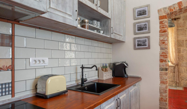 Professional kitchen in rustic style in Croatian seafront luxury villa Vis for total privacy by the sea.