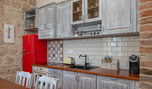 Equipped kitchen in rustic style in seafront luxury villa Vis for total privacy by the sea.