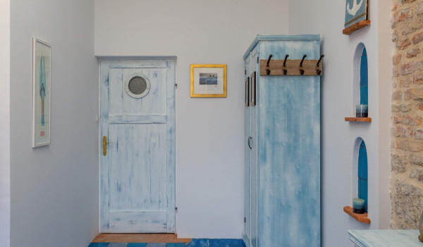 Rustic interior of bedroom in seafront luxury rental villa on Vis with jacuzzi for total privacy.