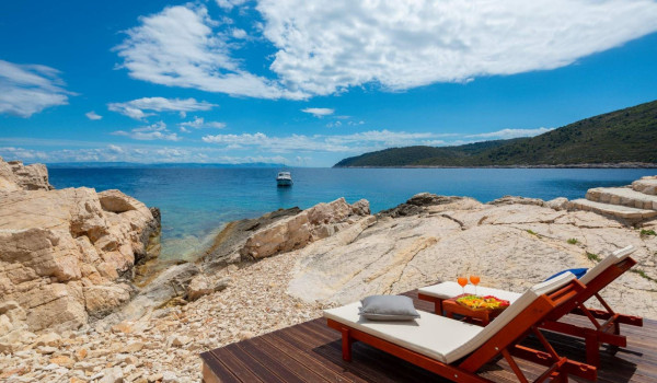 Sunbathing area by the sea in luxury private villa Lighthouse Ligero on Vis with jacuzzi.