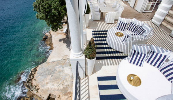 Lounge chairs on the private terrace overlooking the sea of the luxury vacation villa in Dubrovnik with private pool