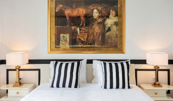 King size bed in bedroom of the beachfront vacation villa Sea Diamant with private pool