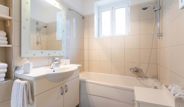 Bathroom with sink and tub of the modern vacation villa in Dubrovnik with private beach