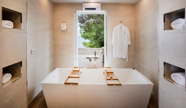 Big tub in the ensuite bathroom with direct entrance to the terrace of the luxury beachfront villa in Dubrovnik
