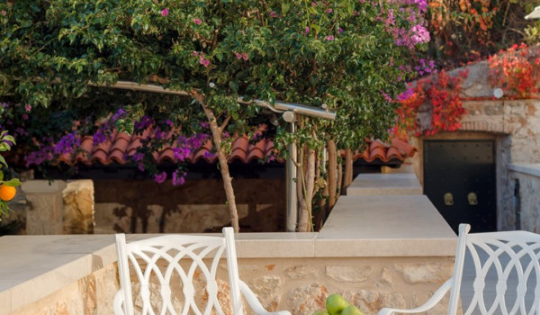 Outdoor seating area on the terrace of Croatia luxury pool villa for vacation and rent with friends