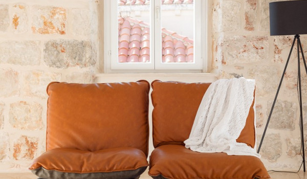 Living room area of Croatia luxury pool villa with sofa and coffee table perfect for family vacation