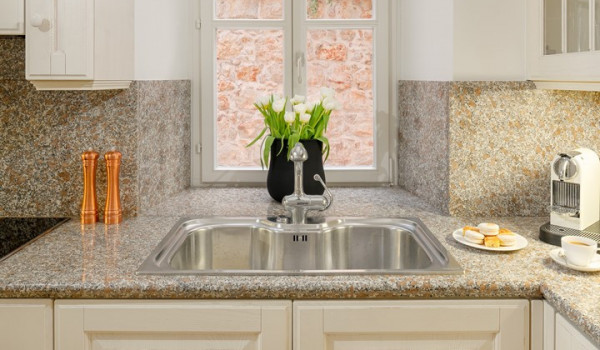 Kitchen area of Croatia luxury pool villa for rent with sink and coffee maker for family vacation