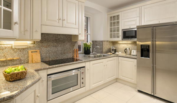 Fully equipped kitchen area of Croatia luxury pool villa with refrigerator and microwave for vacation