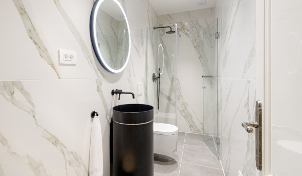 Modern bathroom of Croatia luxury family villa with shower cabin and sink with mirror for vacation