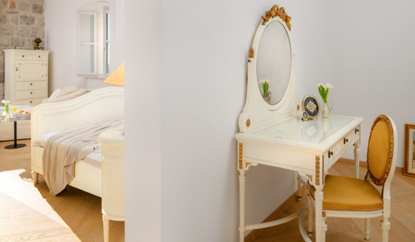 Bedroom of Croatia luxury pool villa with king-size bed and make-up corner for family vacation