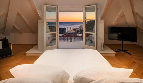 Bedroom of Croatia luxury pool villa with king-size bed and private balcony with sea view for vacation