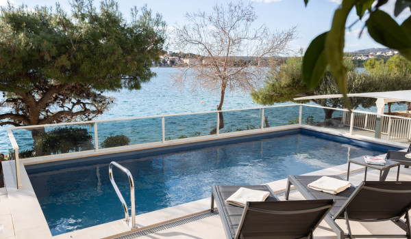 Lounge chairs by the private pool of the Luxury Villa Sea Hug