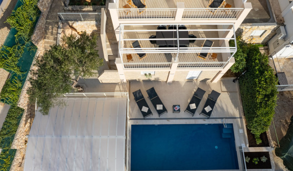 Lounge chairs by the private pool of the Luxury Villa Sea Hug