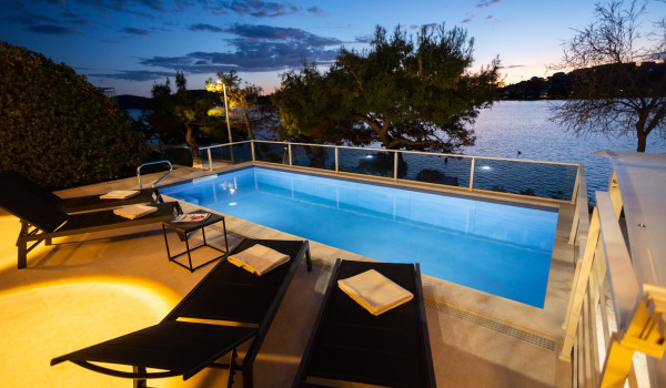 Lounge chairs by the private pool of the Luxury Villa Sea Hug