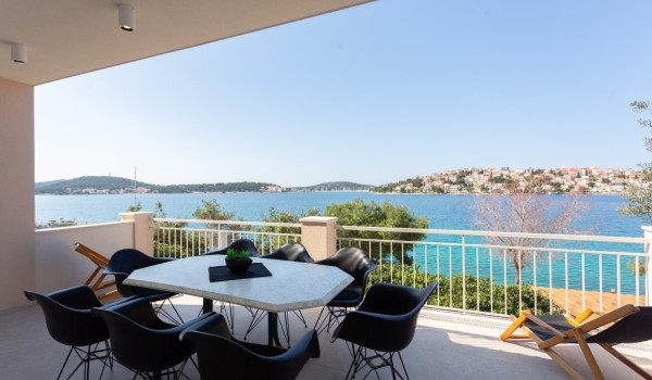 Dining area on the terrace of a Luxury Villa Sea Hug by the sea
