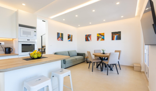 Dining area and living room in a family villa Sea Hug with private pool