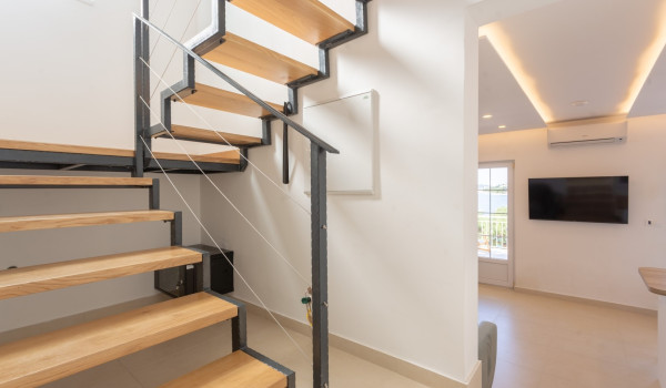 Stairs for the first floor in the seafront villa Sea Hug