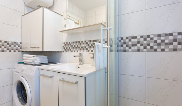 Washing machine in the bathroom of a Luxury Villa with private pool