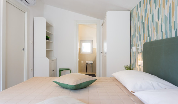 Wardrobe in a double bedroom of a family villa with private pool