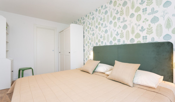 Double bed in a bedroom of a family villa Sea Hug