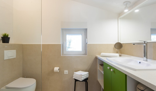 En suite bathroom in a Luxury family villa Sea Hug with a private pool