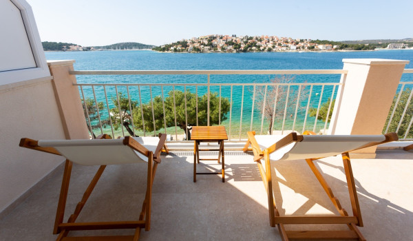 Lounge chairs on the balcony of a Luxury family villa Sea Hug