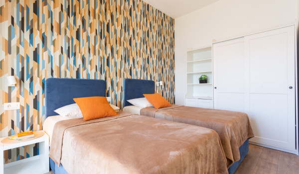 Twin beds in a room of a Luxury family villa Sea Hug