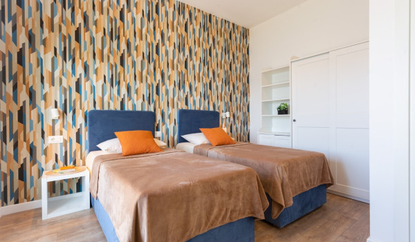 Twin beds in a room of a Luxury family villa Sea Hug