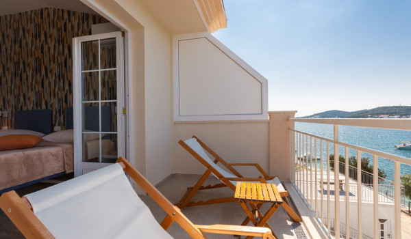 Lounge chairs on the balcony of a Luxury family villa Sea Hug