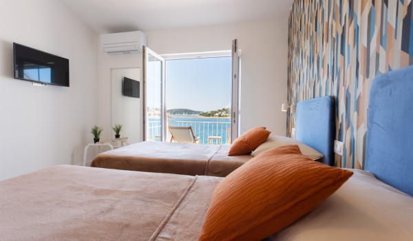 Twin beds in a room of a Luxury family villa Sea Hug