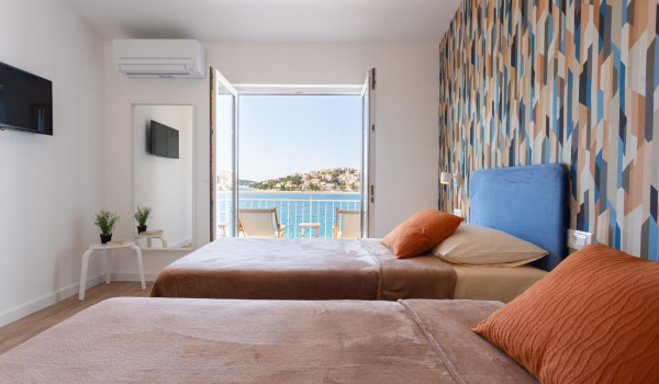 Twin beds in a room of a Luxury family villa Sea Hug