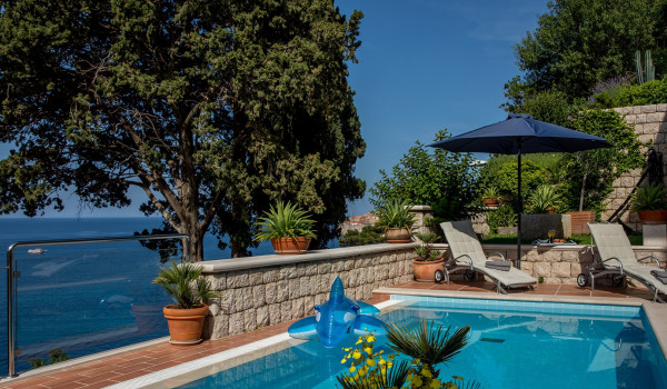 Sun loungers by the private pool of Croatia luxury seafront family villa Dubrovnik Palace