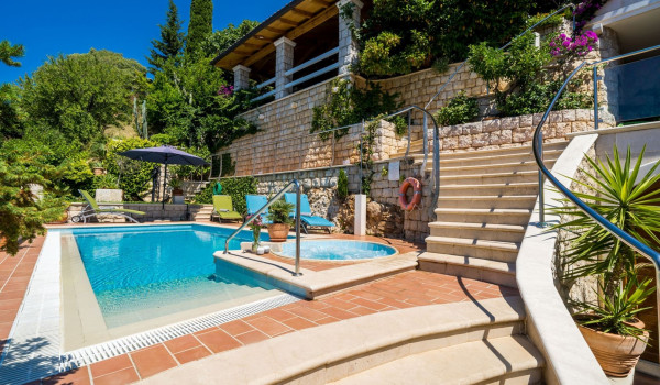 Terrace with private pool and jacuzzi of Croatia luxury villa for family vacation by the sea