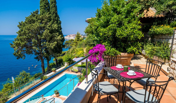 Seating are by the pool overlooking the sea of the Dubrovnik luxury villa for vacation with friends