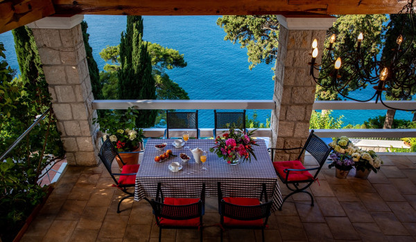 Outside dining table on the terrace of the luxury vacation villa Dubrovnik Palace with concierge service